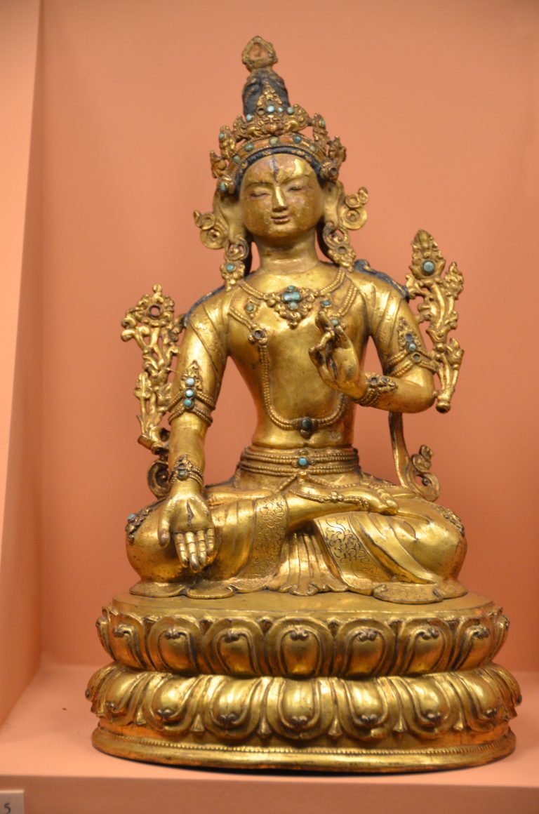 Gilded Tara statue seated on a lotus throne