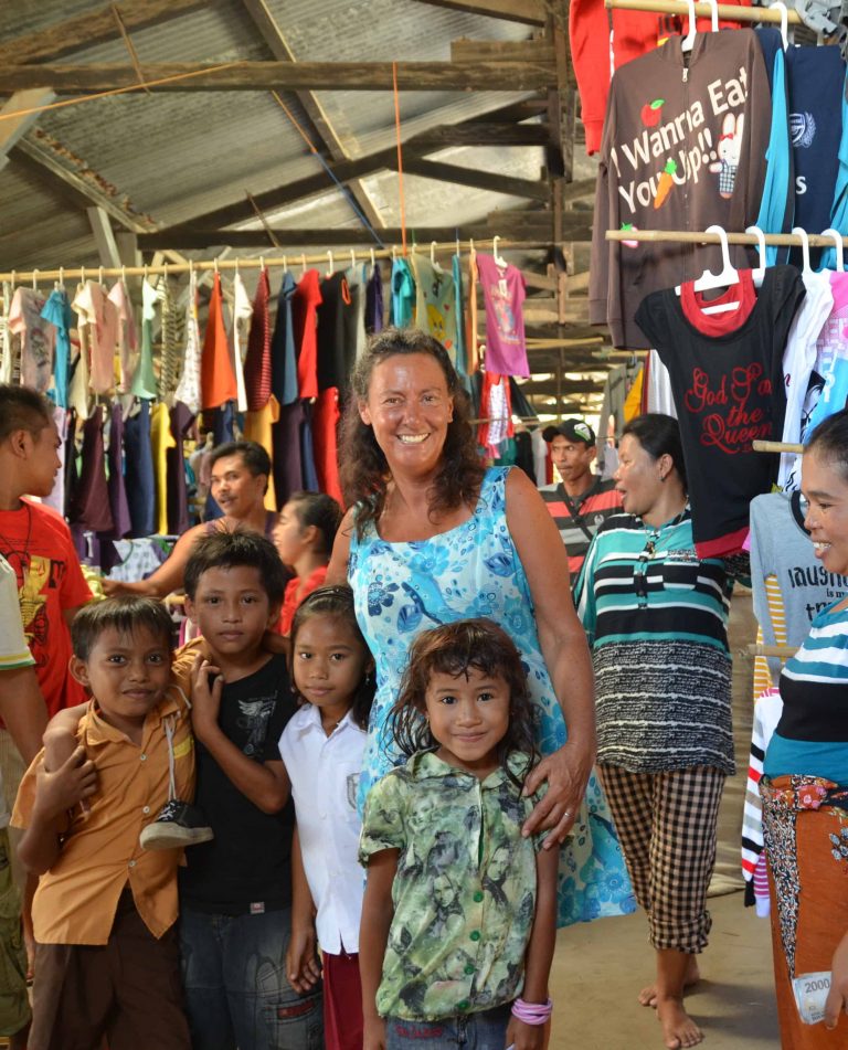 Family and friends gathered at a clothing stall in the market